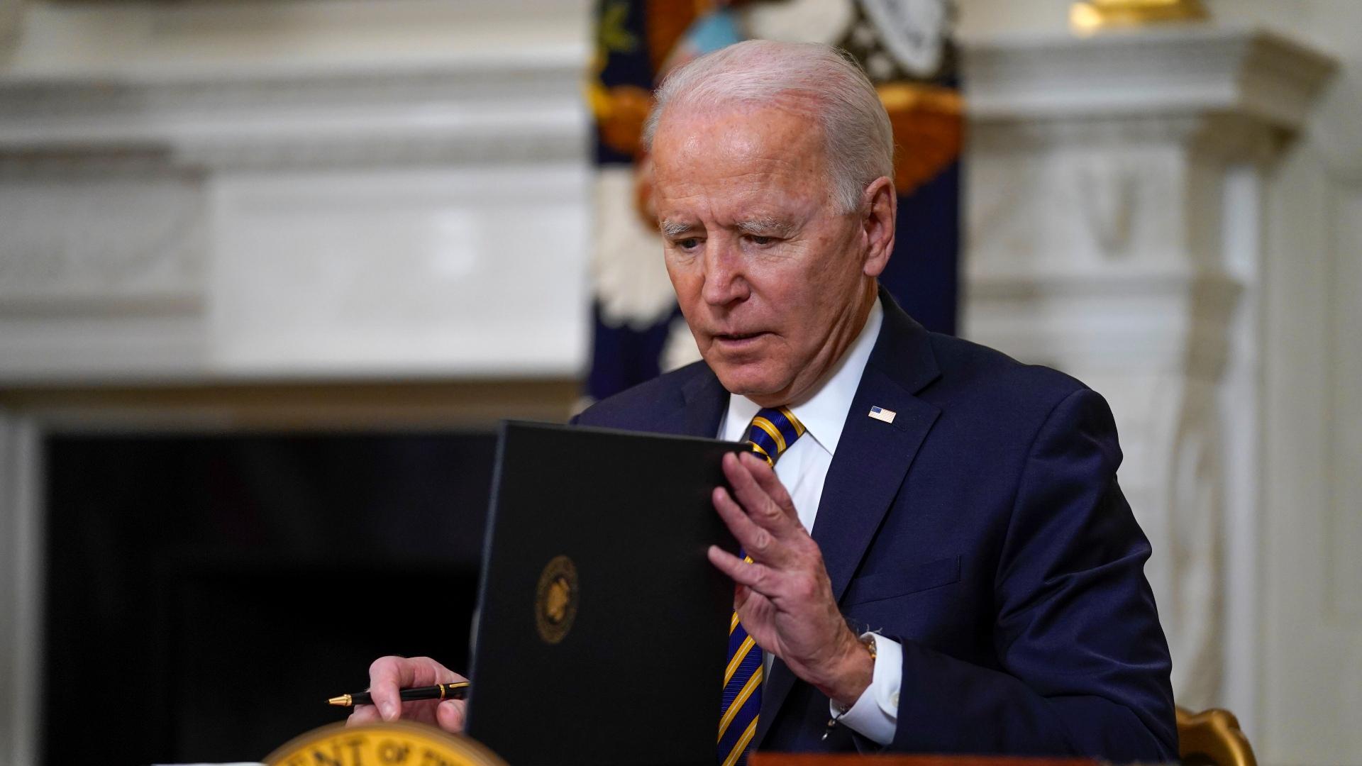 President Joe Biden closes the folder after signing an executive order relating to U.S. supply chains, in the State Dining Room of the White House, Wednesday, Feb. 24, 2021, in Washington. (AP Photo / Evan Vucci)