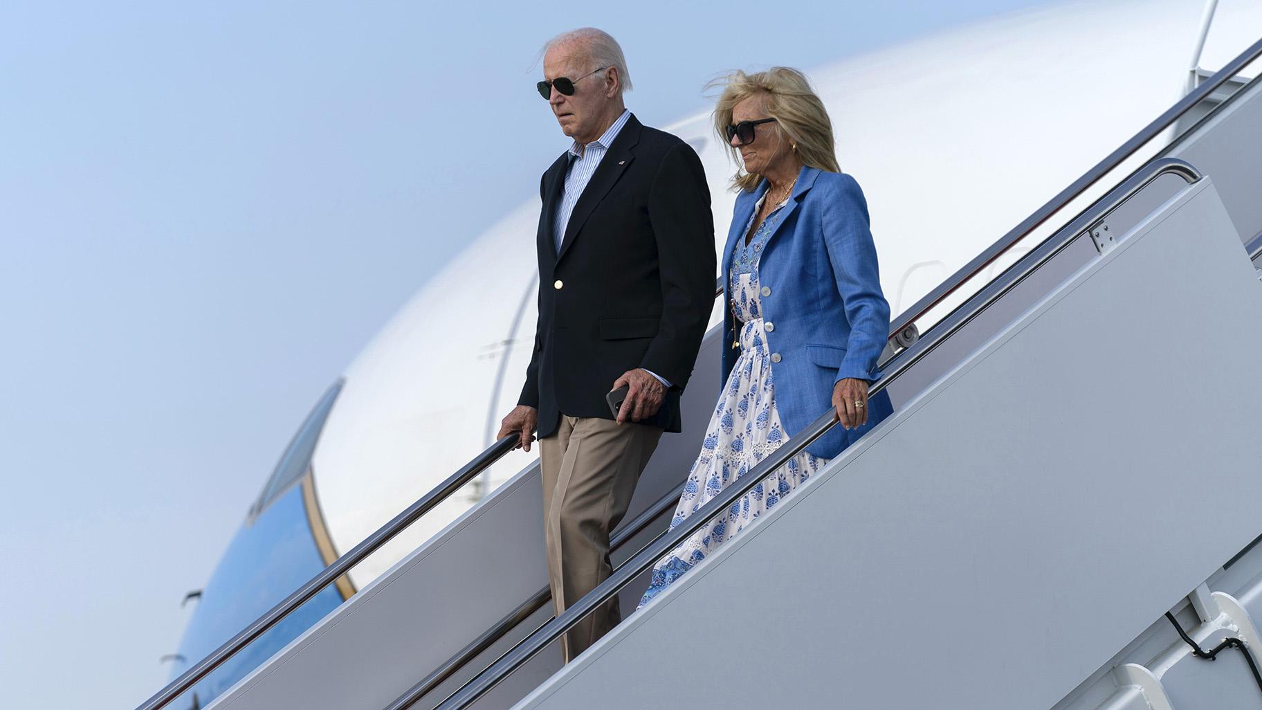President Joe Biden, left, and first lady Jill Biden walk down the stairs of Air Force One upon arrival to Joint Base Andrews, Md., en route to the White House, Sunday, Aug. 18, 2024. (AP Photo / Jose Luis Magana)