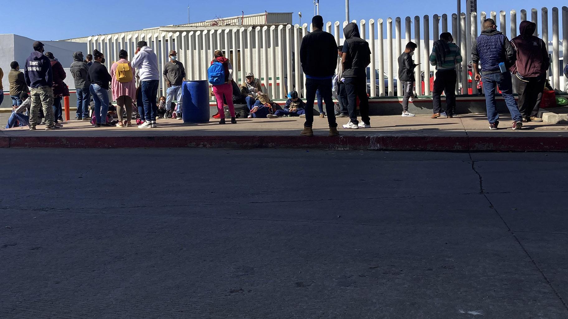 Migrants waiting to cross into the United States wait for news at the border crossing Wednesday, Feb. 17, 2021, in Tijuana, Mexico. (AP Photo / Elliot Spagat)