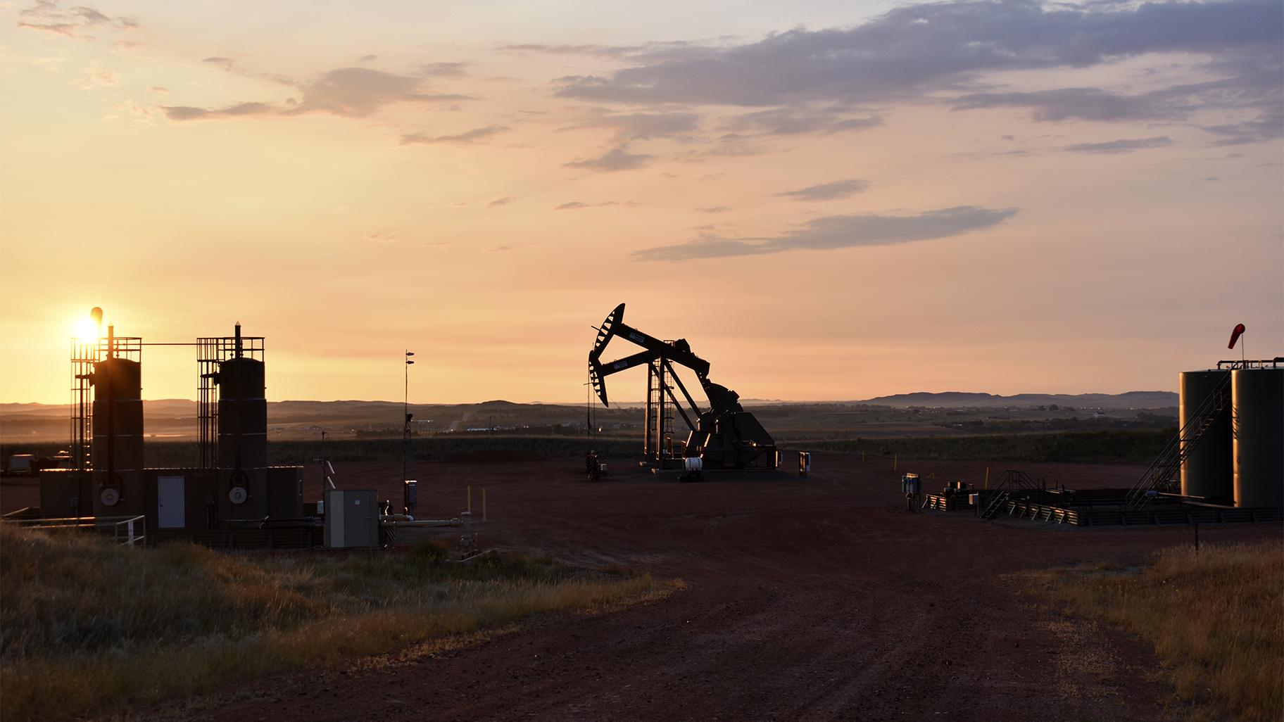 FILE - An oil well works at sunrise Aug. 25, 2021, in Watford City, N.D., part of McKenzie County. (AP Photo / Matthew Brown, File)  