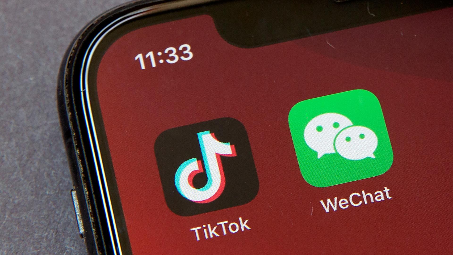 Icons for the smartphone apps TikTok and WeChat are seen on a smartphone screen in Beijing, in a Friday, Aug. 7, 2020 file photo. (AP Photo / Mark Schiefelbein, File)