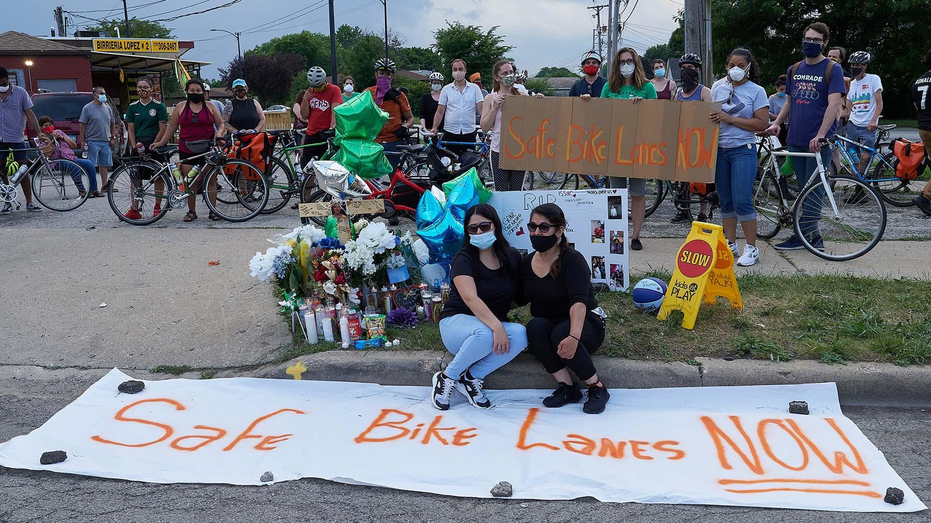 Demonstrators call for bike lanes following the death of Issac Martinez, who was cycling along Lawndale Avenue in June when he was fatally struck by a driver. (@bikelaneuprise / Twitter)