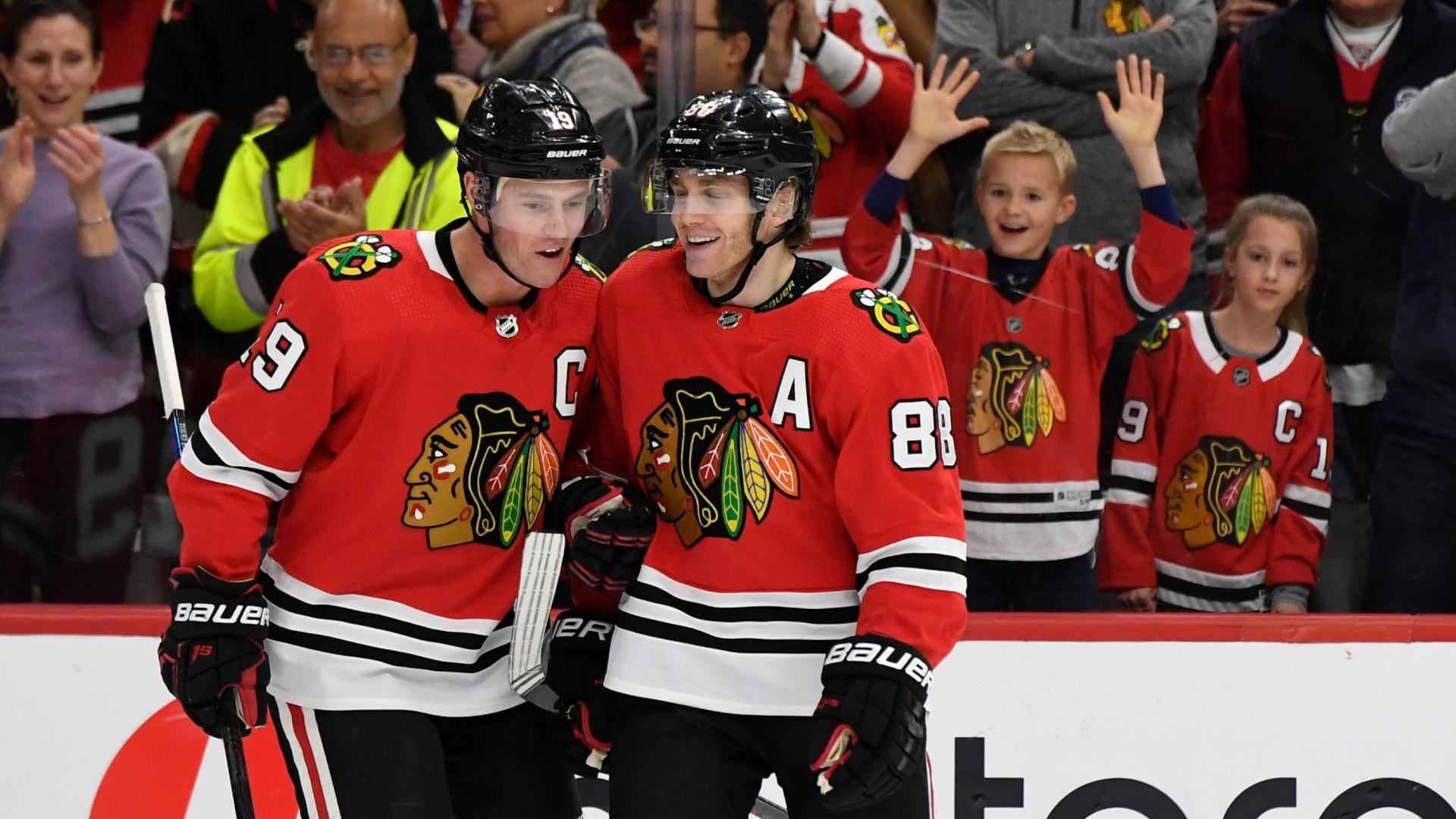 Chicago Blackhawks’ Patrick Kane (88) celebrates with teammate Jonathan Toews (19) after scoring a hat trick during the third period of an NHL hockey game against the Minnesota Wild in Chicago, in this Sunday, Dec. 15, 2019, file photo. (AP Photo / Paul Beaty, File)