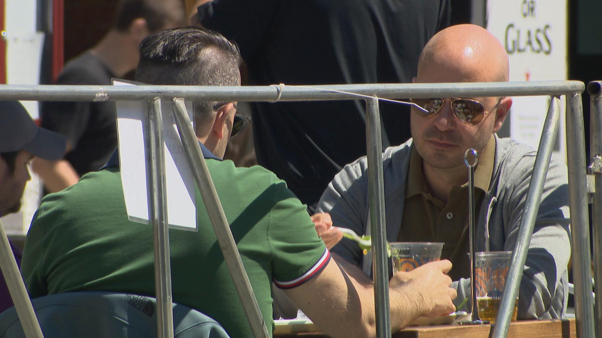 Diners take advantage of expanded outdoor seating along a stretch of Broadway in Chicago on Friday, June 12, 2020. (WTTW News)