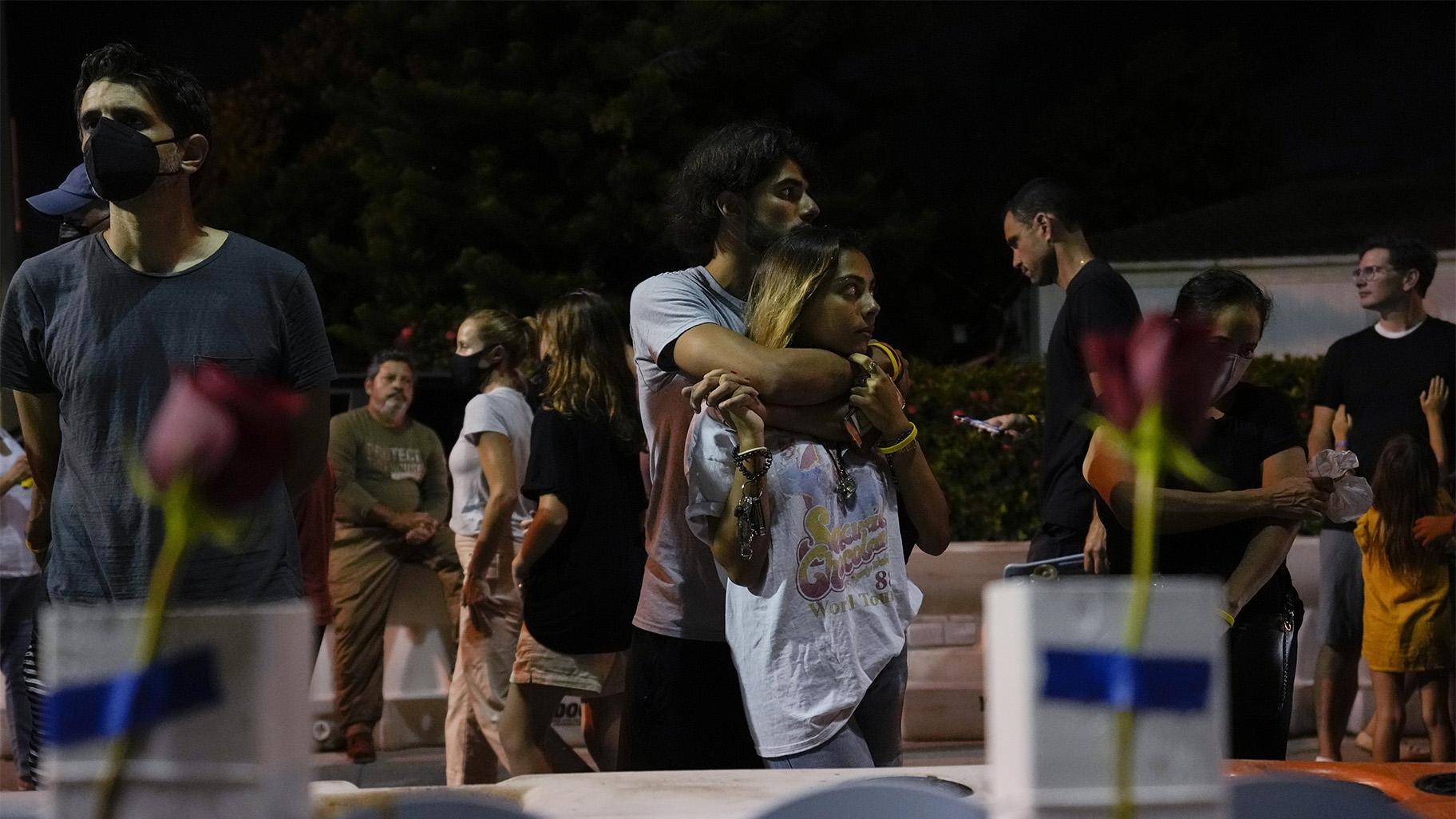 FILE - In this July 15, 2021 file photo, well-wishers and mourners gather at a makeshift memorial for the victims of the Champlain Towers South condo building collapse, for a multi-faith vigil near the site where the building once stood in Surfside, Fla. (AP Photo / Rebecca Blackwell)