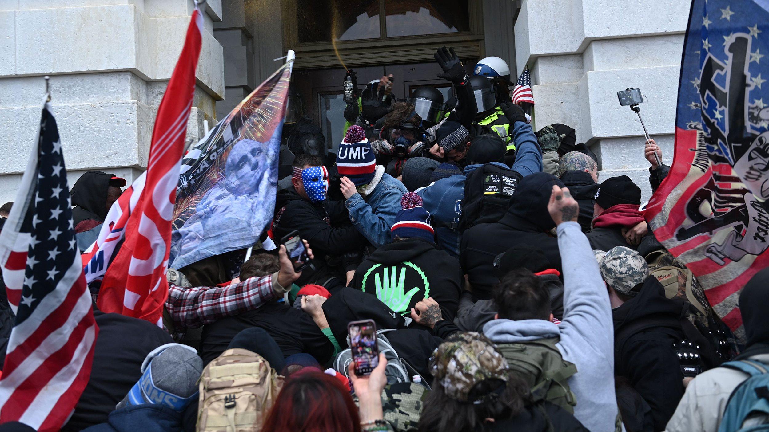 Trump supporters clash with police and security forces as they storm the Capitol in Washington, D.C. on Jan. 6, 2021.(Brendan Smialowski / AFP / Getty Images)