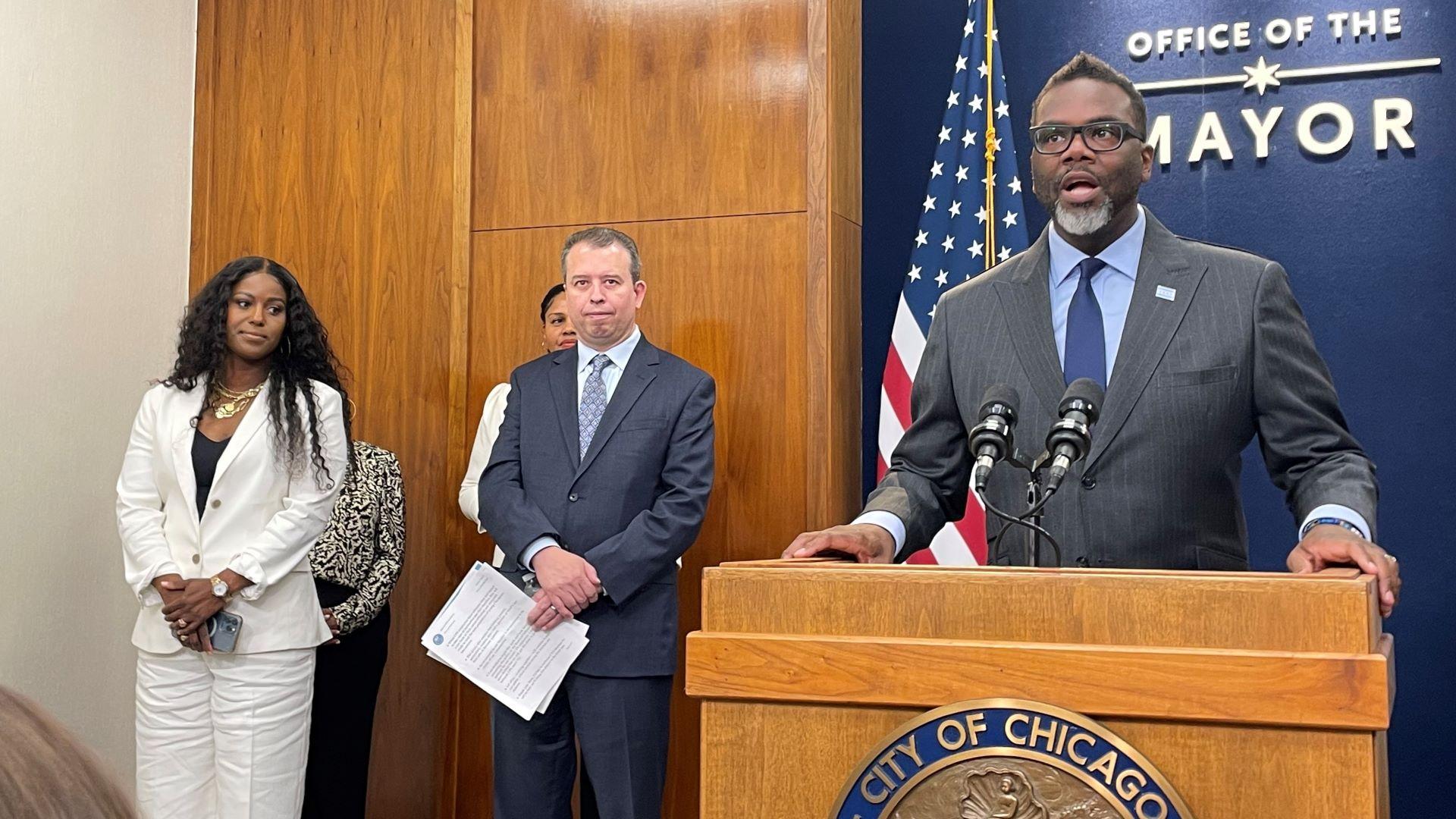 Mayor Brandon Johnson speaks at City Hall alongside Chicago Public Schools CEO Pedro Martinez and Chicago Teachers Union President Stacy Davis Gates on June 8, 2023 (Heather Cherone / WTTW News)