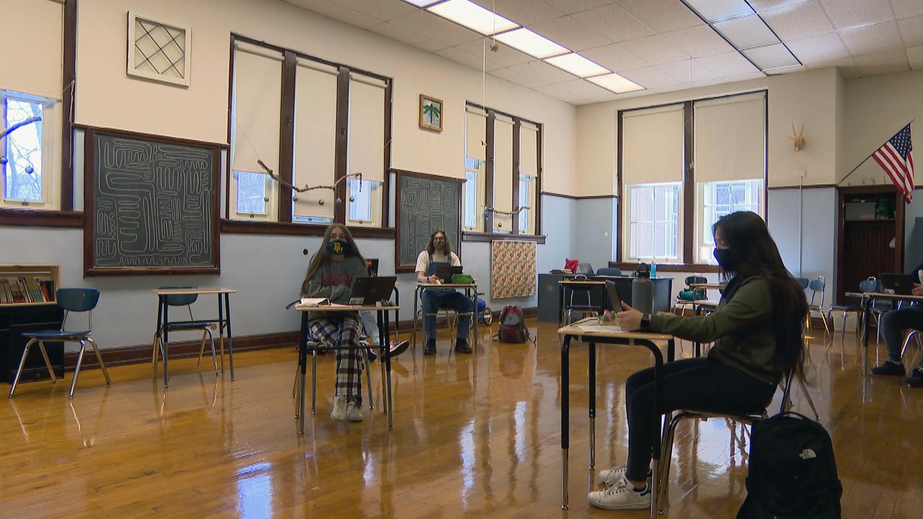 Students sit masked and socially distanced in a CPS classroom. (WTTW News)