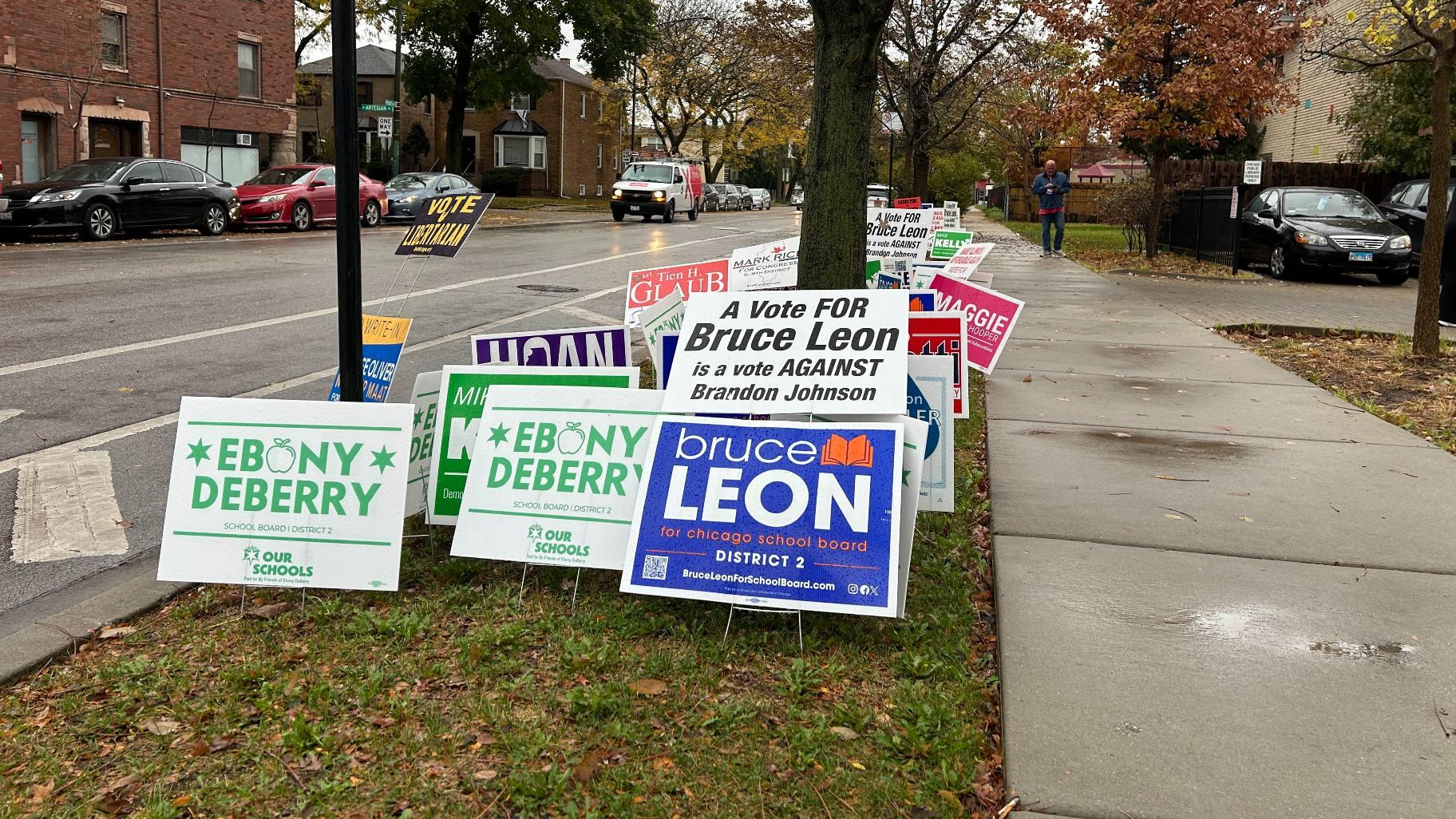 Campaign signs are pictured outside of a Chicago polling place on Nov. 5, 2024. (Blair Paddock / WTTW News)