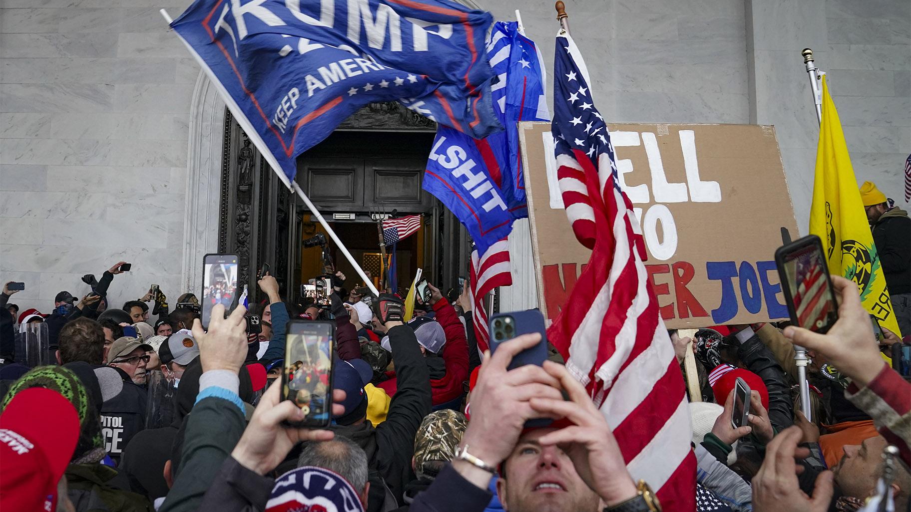 FILE - In this Jan. 6, 2021, file photo insurrections loyal to President Donald Trump riot outside the Capitol in Washington. (AP Photo  /John Minchillo, File)