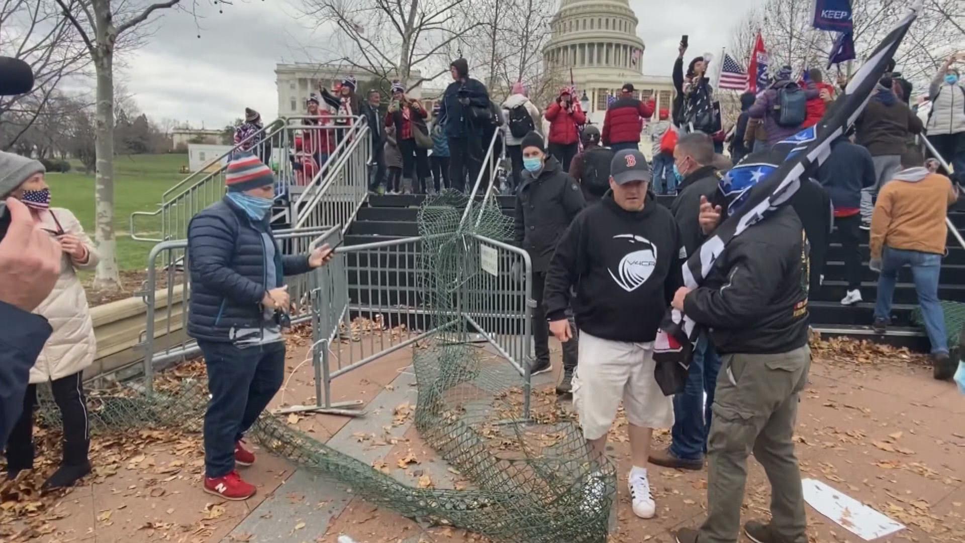 Pro-Trump supporters breach security gates at the U.S. Capitol on Jan. 6, 2021. (WTTW News via CNN)