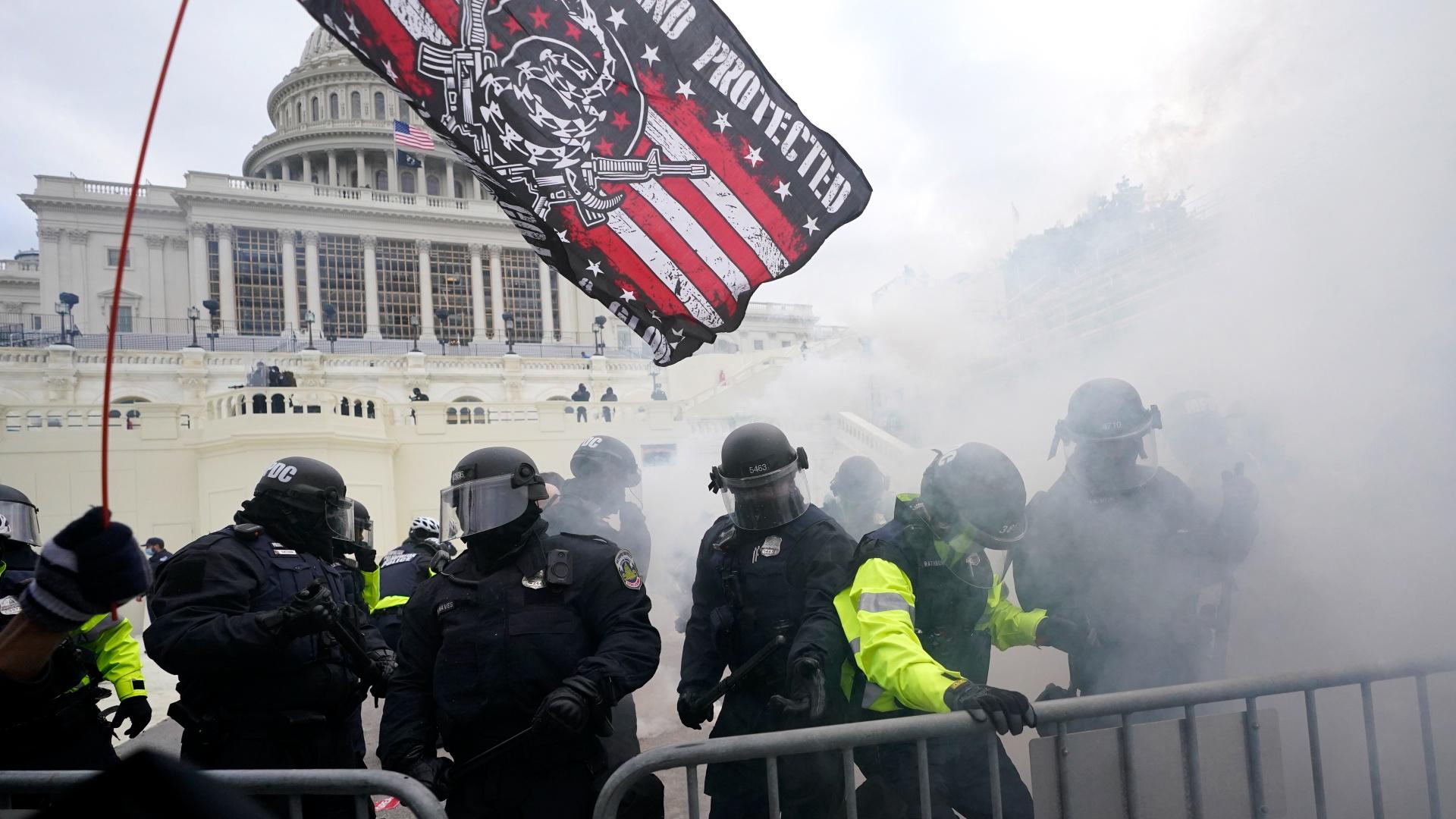 In this Jan. 6, 2021, U.S. Capitol Police officers hold off rioters loyal to President Donald Trump at the Capitol in Washington. (AP Photo / Julio Cortez, File)
