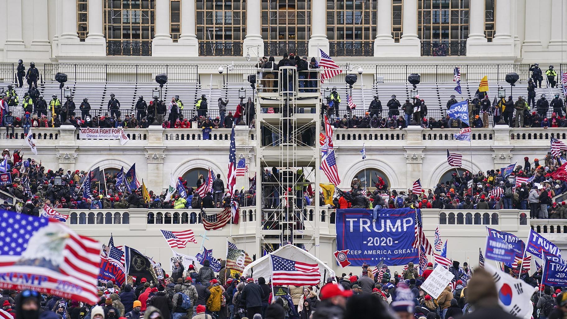 Insurrectionists loyal to President Donald Trump breach the Capitol in Washington, Jan. 6, 2021. (AP Photo / John Minchillo, File)