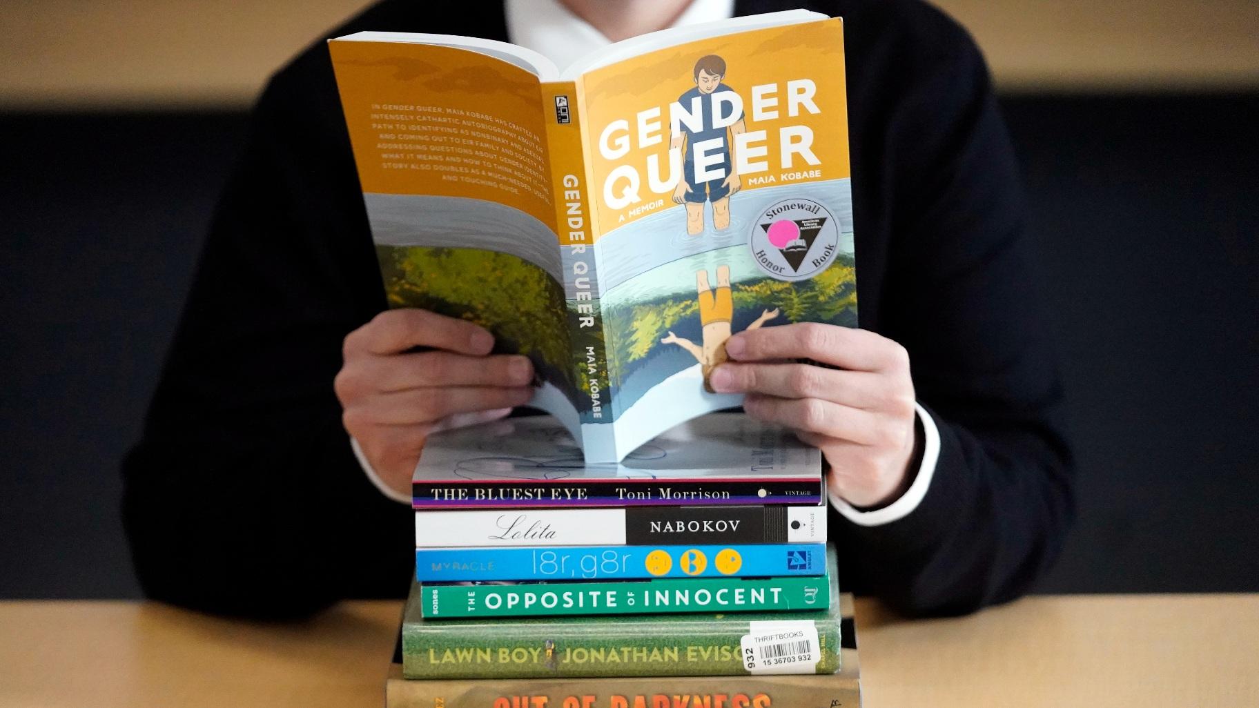 A pile of challenged books appear at the Utah Pride Center in Salt Lake City on Dec. 16, 2021. (AP Photo / Rick Bowmer, File)