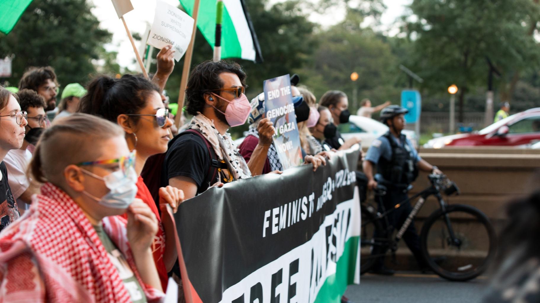 Protesters March down Michigan Avenue in Chicago on Sunday, Aug. 18, 2025, ahead of the start of the Democratic National Convention. (Michael Izquierdo / WTTW News)