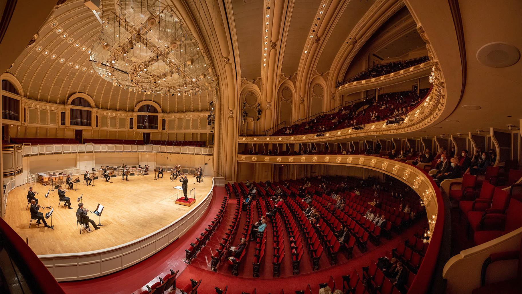 A socially distanced, reduced-capacity audience listens to the sounds of the CSO brass at the concert that signaled the return of Chicago Symphony Orchestra concerts, May 27, 2021. (Credit Anne Ryan) 