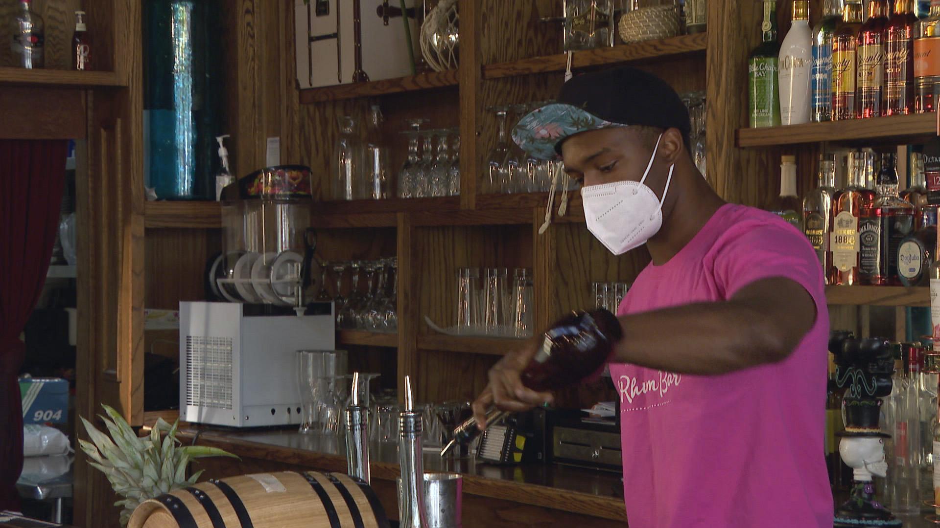 A bartender mixes a drink at the Chicago restaurant 14 Parish. (WTTW News)