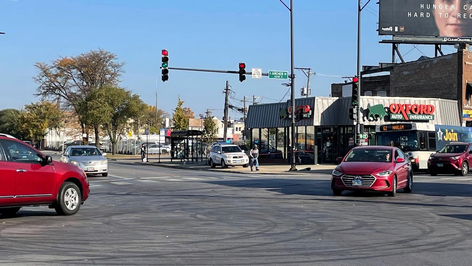 Tire marks from drifting can be seen in the intersection of Archer and Kedzie avenues, where a shooting occurred early Sunday, Oct 23, 2022. (David Struett/Chicago Sun-Times via AP)