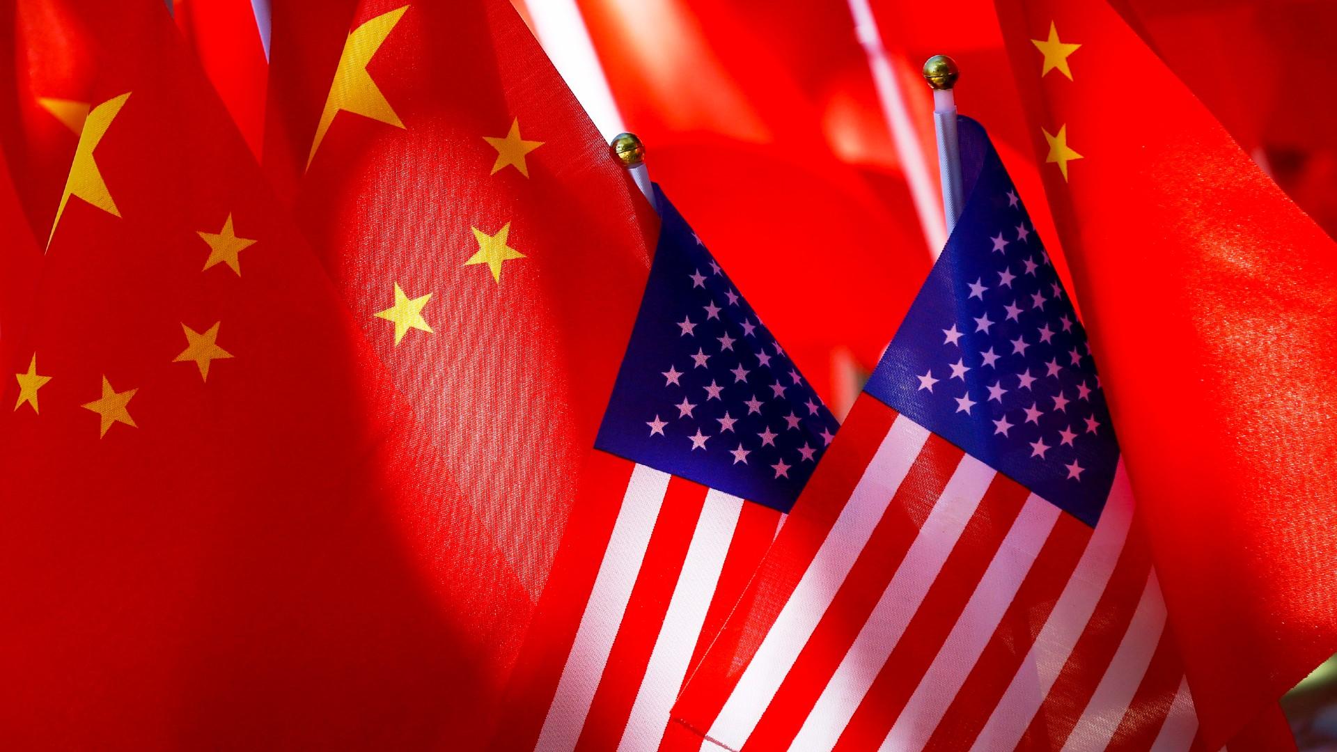 American flags are displayed together with Chinese flags on top of a trishaw on Sept. 16, 2018, in Beijing. (AP Photo / Andy Wong, File) American flags are displayed together with Chinese flags on top of a trishaw on Sept. 16, 2018, in Beijing. (AP Photo / Andy Wong, File)