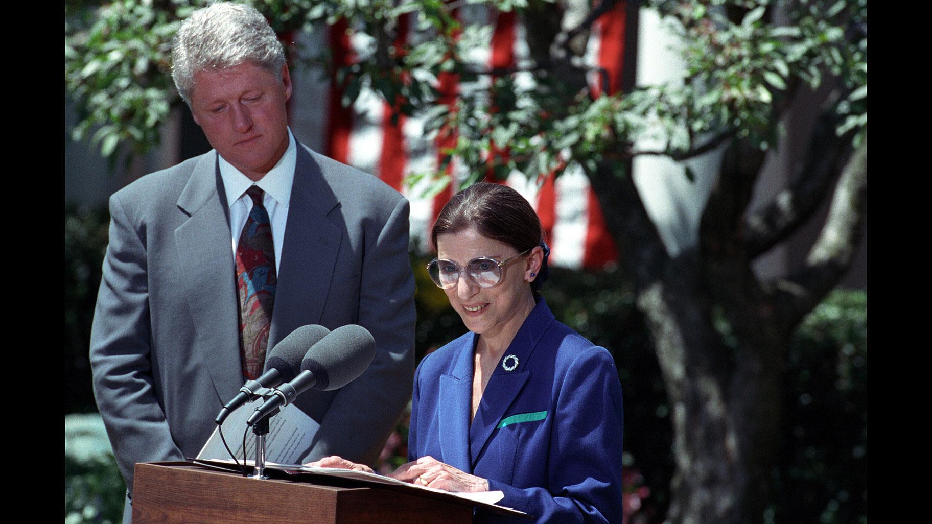 President Bill Clinton looks on as Ruth Bader Ginsburg speaks after the announcement of her nomination to the Supreme Court in June 1993. (Sharon Farmer / National Archives and Records Administration)