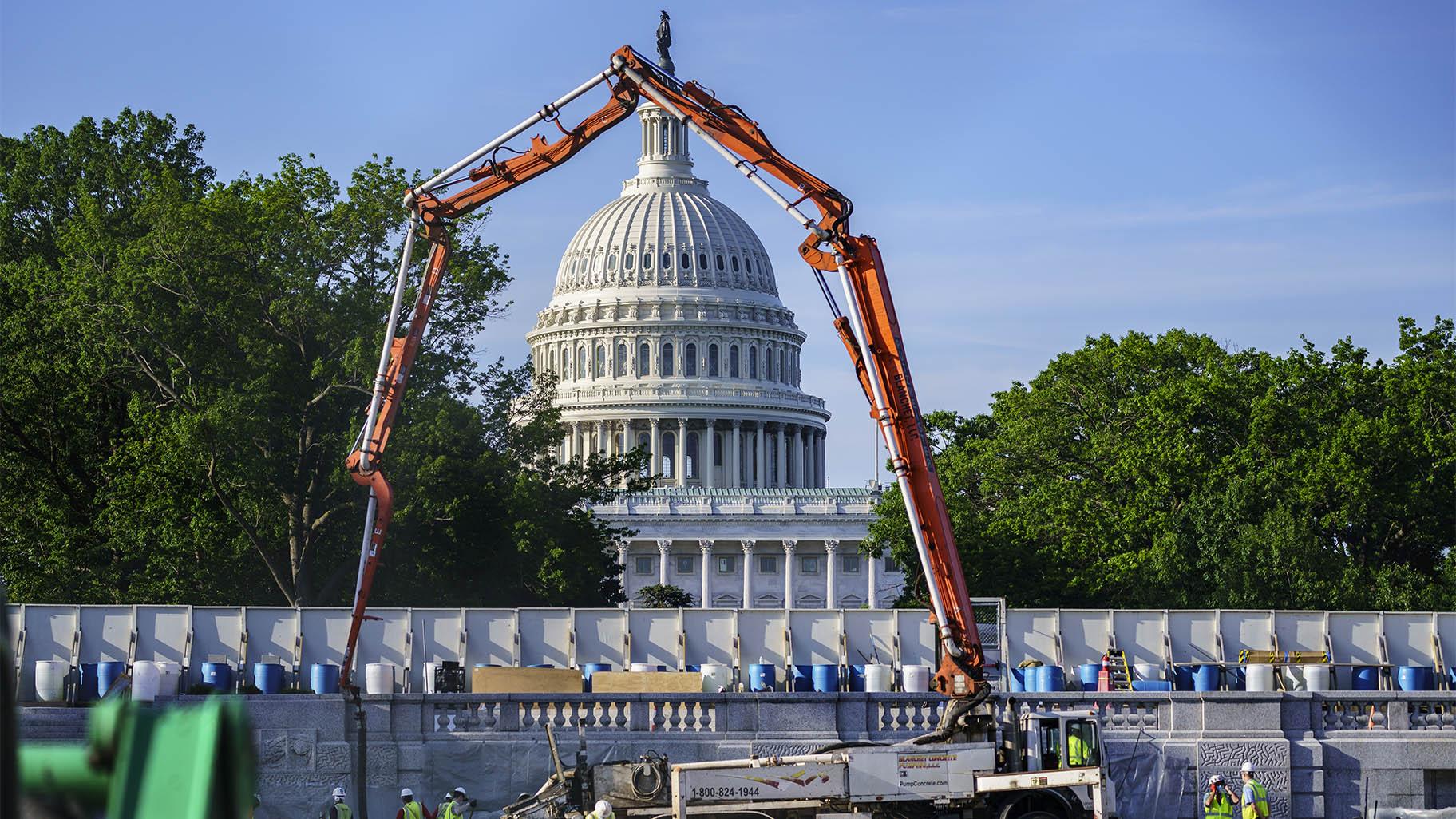 A concrete pump frames the Capitol Dome during renovations and repairs to Lower Senate Park on Capitol Hill in Washington, Tuesday, May 18, 2021. (AP Photo / J. Scott Applewhite)