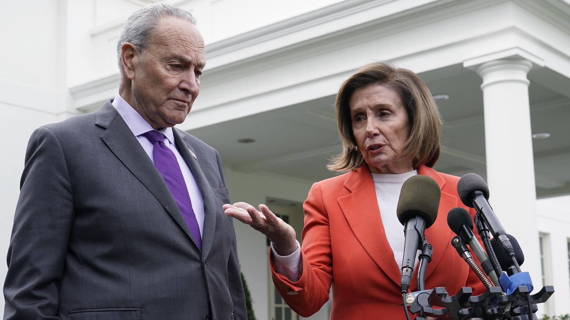 Senate Majority Leader Chuck Schumer of N.Y., right, listens as House Speaker Nancy Pelosi of Calif., left, speaks to reporters at the White House in Washington, Nov. 29, 2022, about their meeting with President Joe Biden. (AP Photo/Susan Walsh)