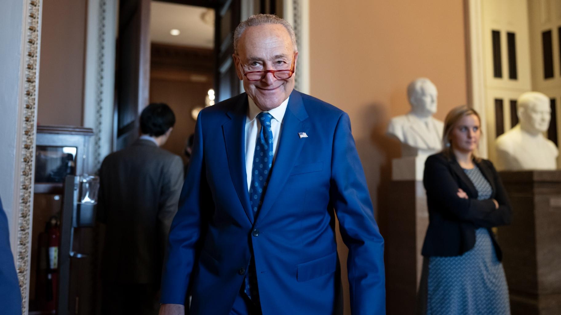 Senate Majority Leader Chuck Schumer, D-N.Y., grins as he emerges from the closed-door Senate Democratic Caucus leadership election at the Capitol in Washington, Thursday, Dec. 8, 2022. (AP Photo / J. Scott Applewhite)