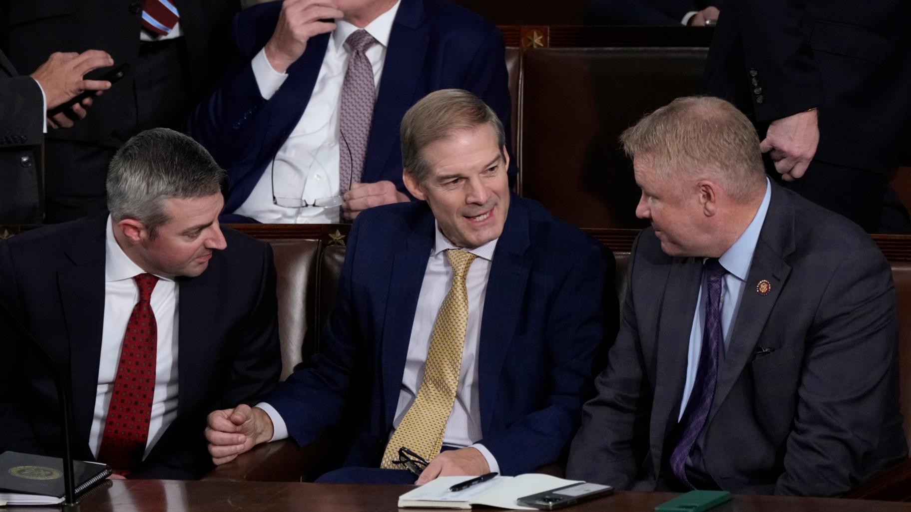 Rep. Jim Jordan, R-Ohio, chairman of the House Judiciary Committee, seated center, talks to Rep. Warren Davidson, R-Ohio, right, and a House staff member, left, as Republicans try to elect Jordan, a top Donald Trump ally, to be the new House speaker, at the Capitol in Washington, Tuesday, Oct. 17, 2023. (J. Scott Applewhite / AP Photo)
