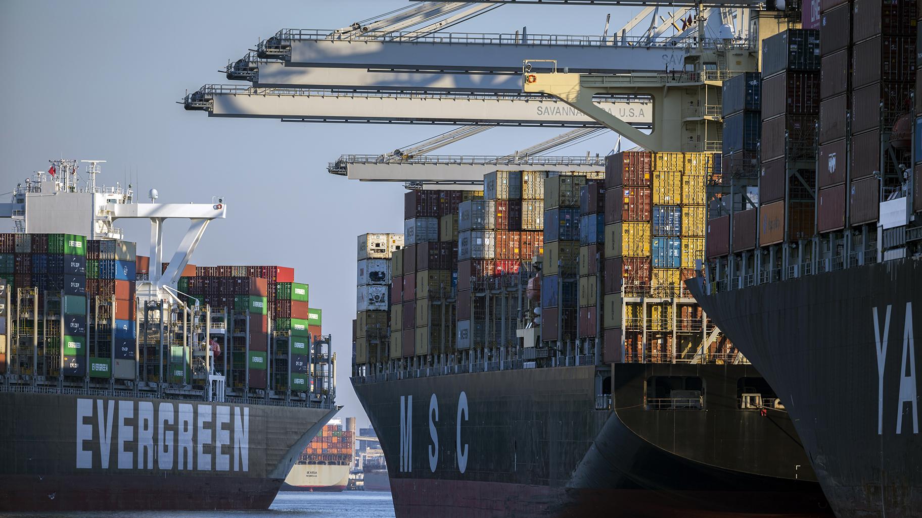 Container ship Ever Far, left, sails down river past the Georgia Ports Authority's Port of Savannah, Wednesday, Sept. 29, 2021, in Savannah, Ga. (AP Photo/Stephen B. Morton)