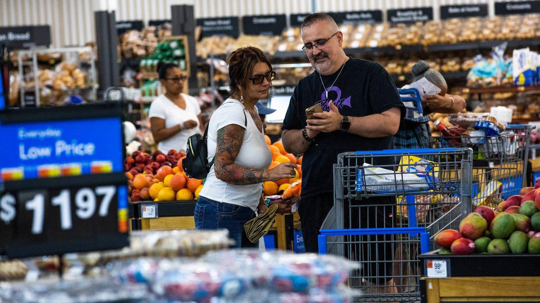 Shoppers pause in the produce section at a Walmart Superstore in Secaucus, New Jersey, July 11, 2024. (AP Photo/Eduardo Munoz Alvarez, File)