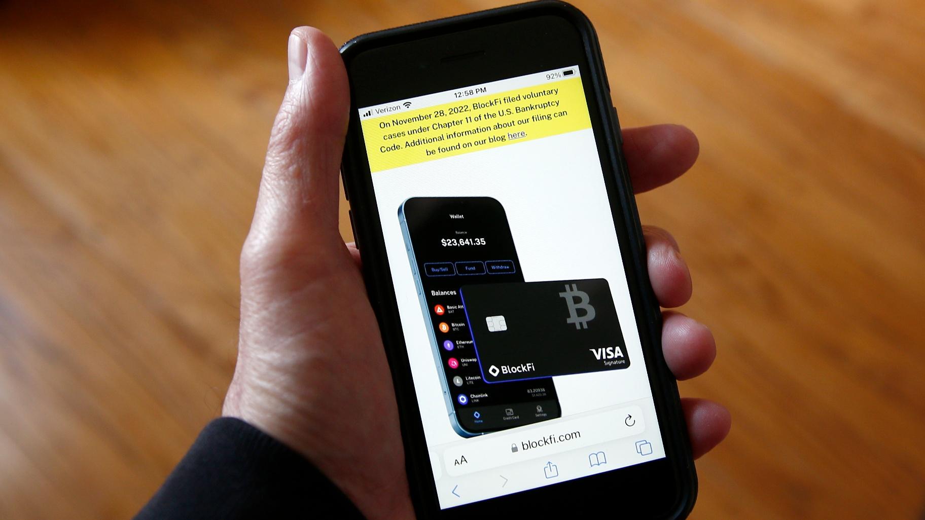Text, in yellow, announcing cryptocurrency lender BlockFi’s bankruptcy filing, appears on the company’s website on a smartphone, Nov. 28, 2022, in New York. (AP Photo / Peter Morgan, File)