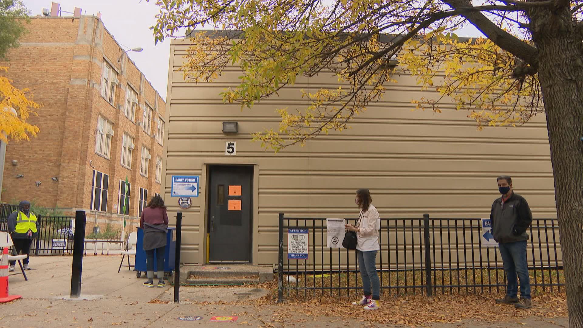 People line up for early voting in Chicago on Wednesday, Oct. 14, 2020. Amid the pandemic, many residents in the city and state have requested mail-in ballots for the Nov. 3 election. (WTTW News)