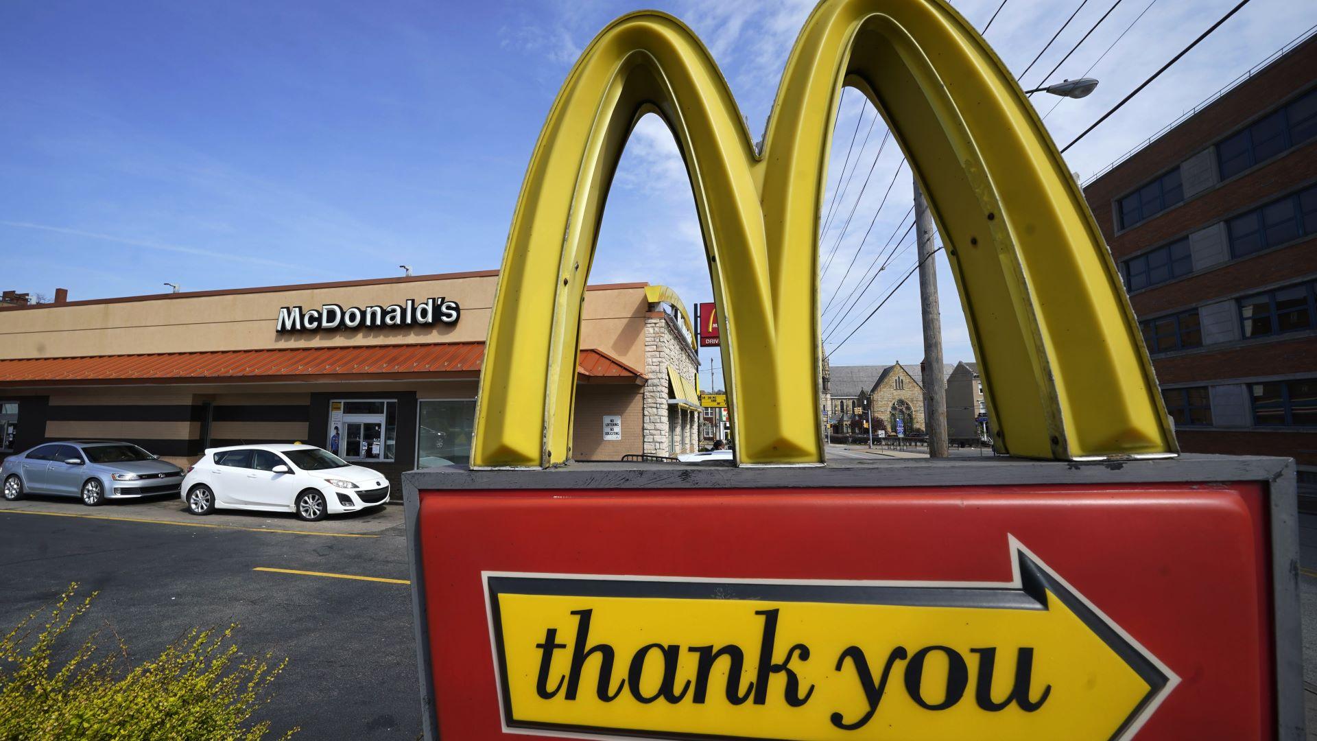 An exit sign is shown at a McDonald's restaurant in Pittsburgh on Saturday, April 23, 2022. McDonald’s reported better-than-expected sales in the third quarter, Thursday, Oct. 27, 2022, as it charged higher prices and drew in customers with its Camp McDonald’s promotion. (AP Photo/Gene J. Puskar, File)