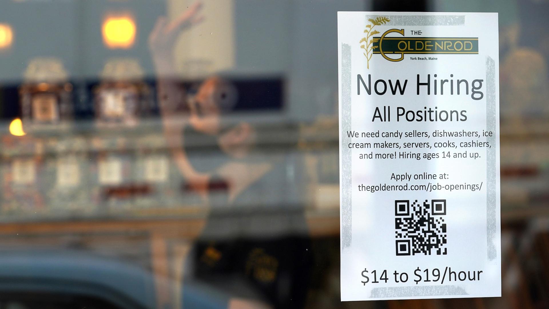 A sign advertises for help The Goldenrod, a popular restaurant and candy shop, Wednesday, June 1, 2022, in York Beach, Maine. (AP Photo/Robert F. Bukaty, File)