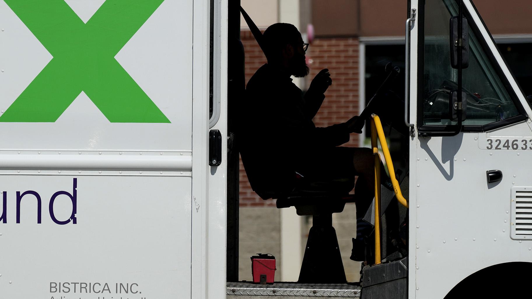 A FedEx driver makes deliveries in Palatine, Ill., Wednesday, Sept. 13, 2023. On Friday, the U.S. government issues its latest monthly jobs report. (AP Photo / Nam Y. Huh)