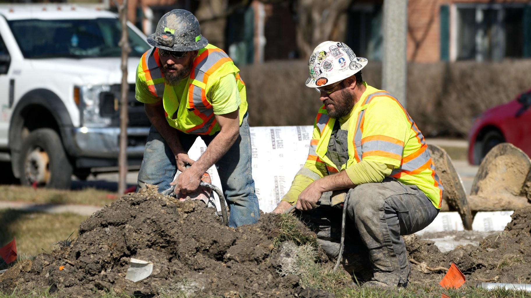 Construction workers work in Mount Prospect, Ill., Monday, Feb. 26, 2024. (AP Photo / Nam Y. Huh, File)