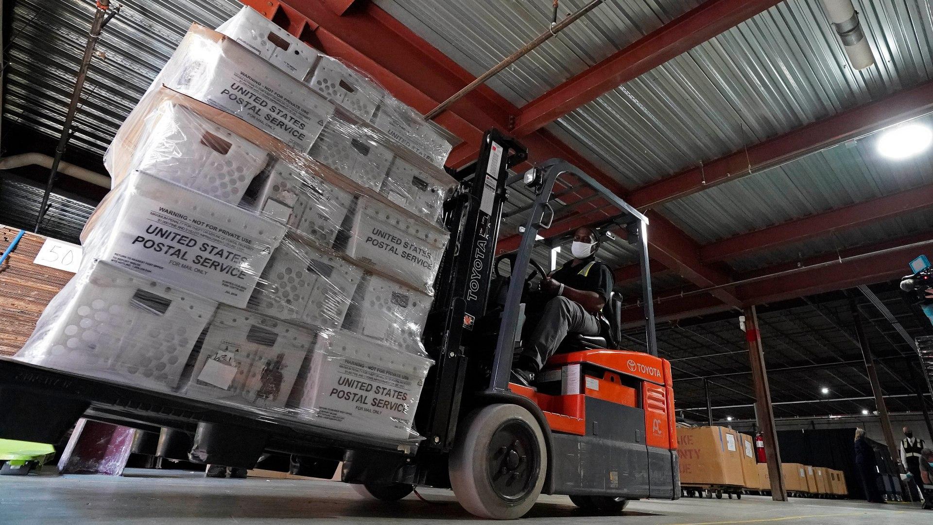 In this Sept. 3, 2020, file photo, a forklift operator loads absentee ballots for mailing at the Wake County Board of Elections as preparations for the upcoming election are ongoing in Raleigh, N.C. (AP Photo / Gerry Broome, File)