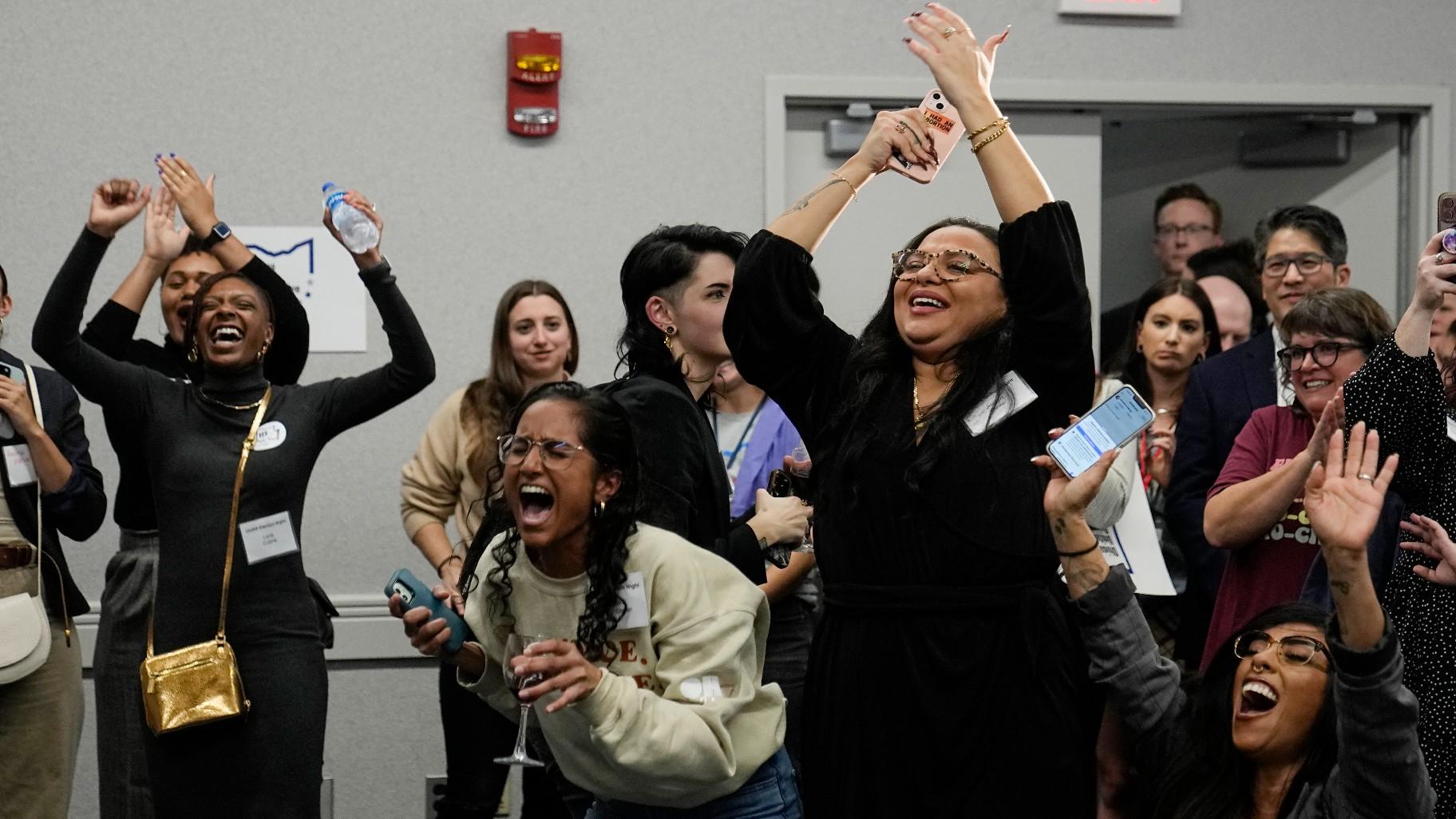 Issue 1 supporters celebrate as Rhiannon Carnes, executive director, Ohio Wome’s Alliance, speaks at a watch party, Tuesday, Nov. 7, 2023, in Columbus Ohio. (AP Photo / Sue Ogrocki)