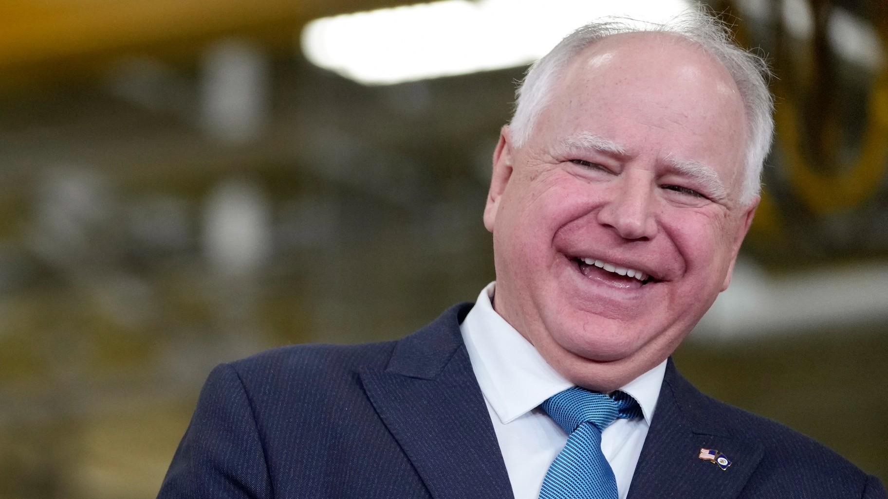 Minnesota Gov. Tim Walz, right, laughs as he stands with Fridley, Minn., Mayor Scott Lund during a visit to the Cummins Power Generation Facility in Fridley, Minn., Monday, April 3, 2023. (AP Photo / Carolyn Kaster, File)