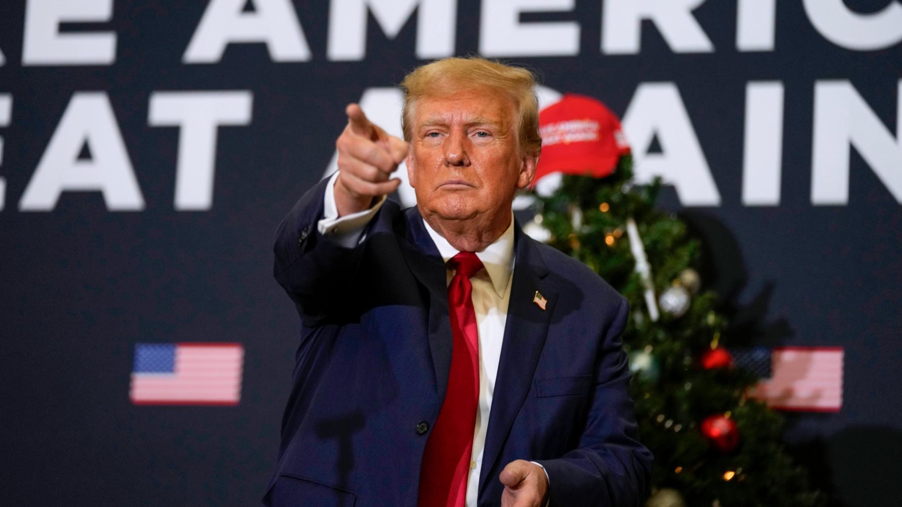 FILE - Former President Donald Trump points to supporters during rally Dec. 19, 2023, in Waterloo, Iowa. (Charlie Neibergall / AP Photo, File)