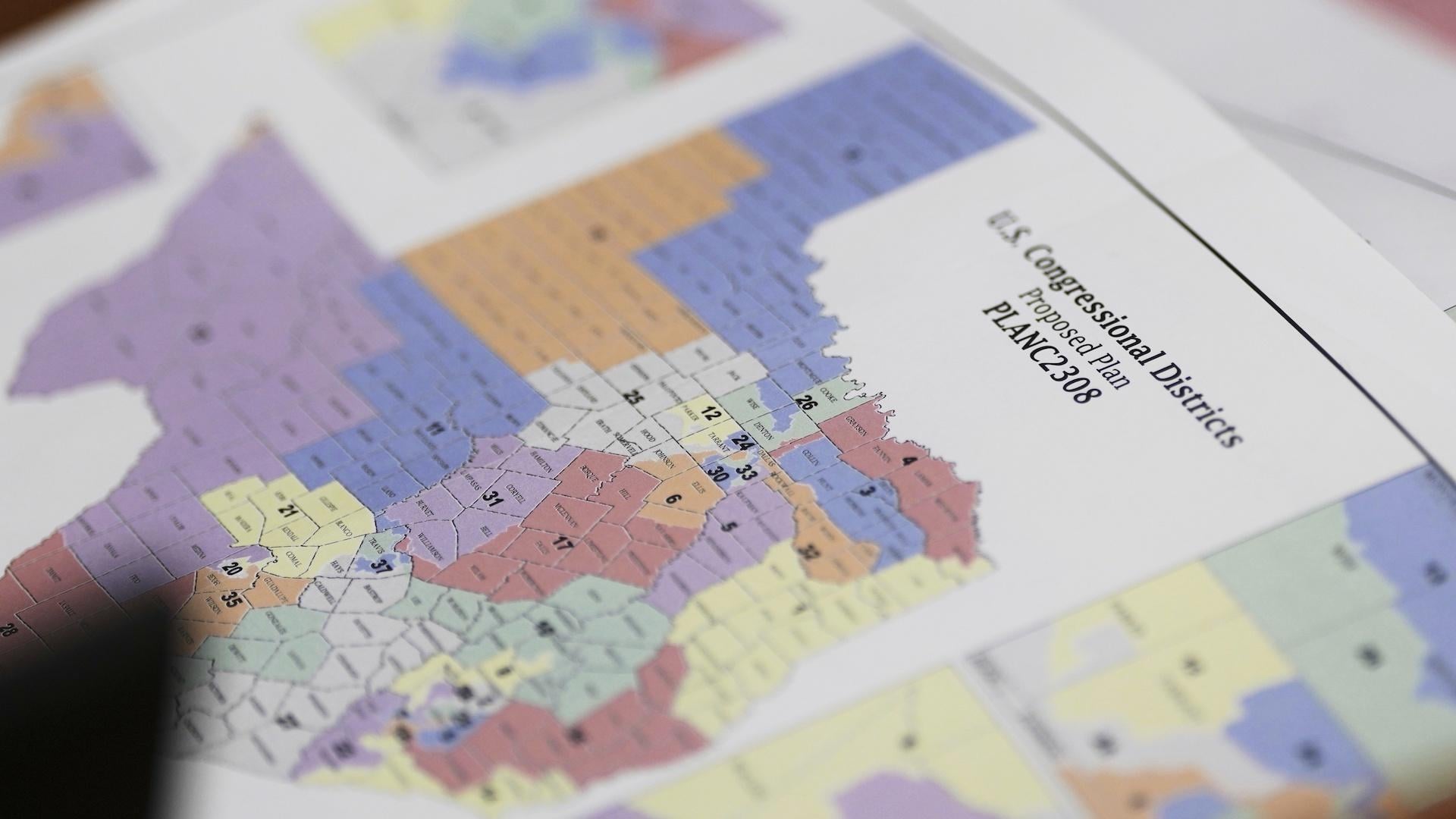 A map of U.S Congressional Districts proposed plan is seen at a Texas legislators' public hearing on congressional redistricting in Austin, Texas, Aug. 1, 2025. (AP Photo/Eric Gay, file)