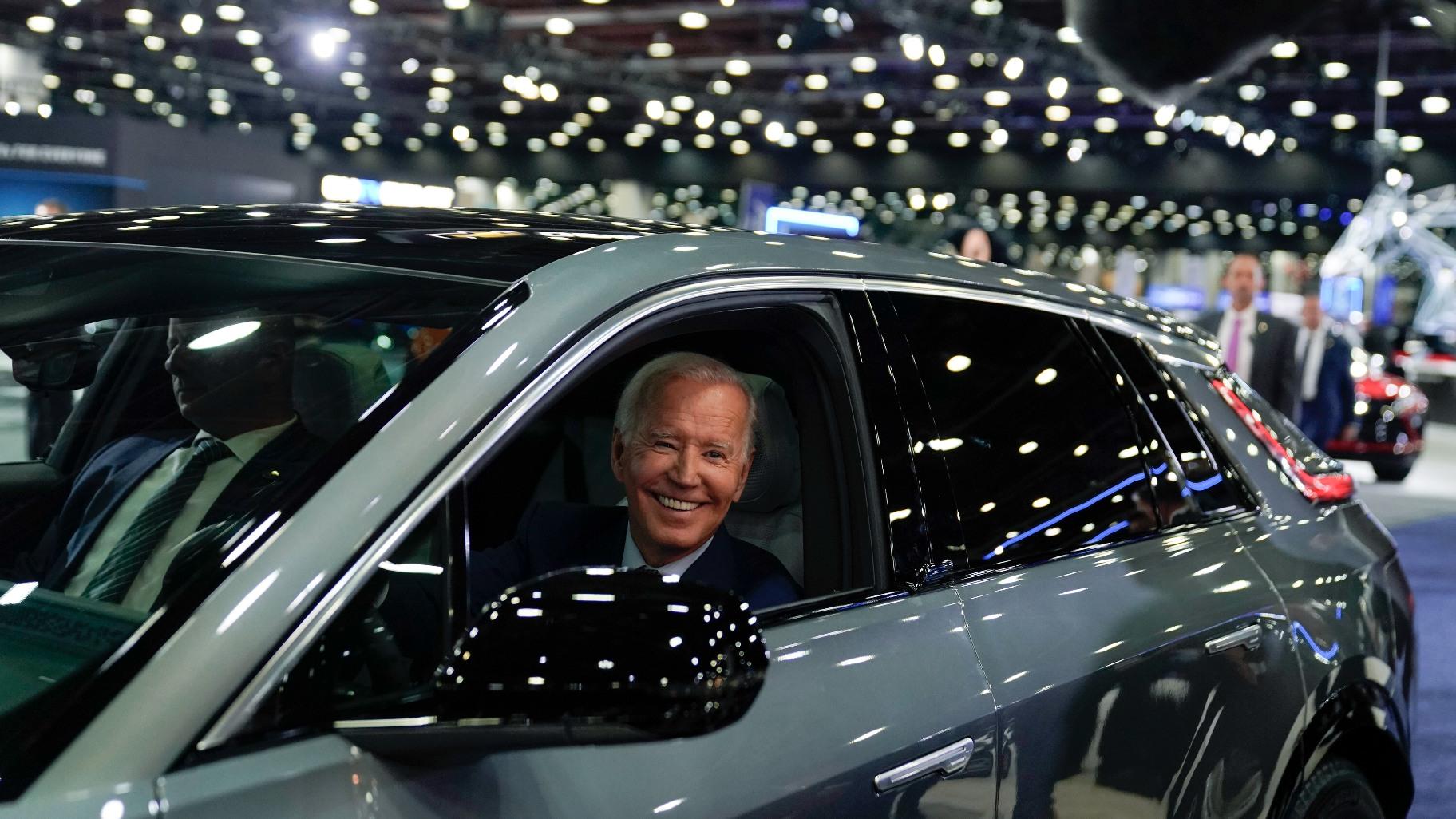 President Joe Biden drives a Cadillac Lyriq through the showroom during a tour at the Detroit Auto Show, Sept. 14, 2022, in Detroit. (AP Photo / Evan Vucci, File)