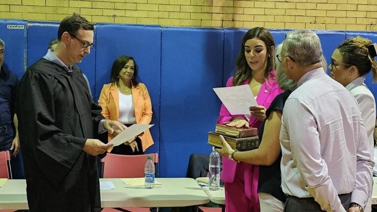 State Sen. Natalie Toro, in pink, takes the oath of office as the representative of the 20th District as Cook County Circuit Court Clerk Iris Martinez, in orange, looks on. (Credit: Illinois Senate Democrats) 