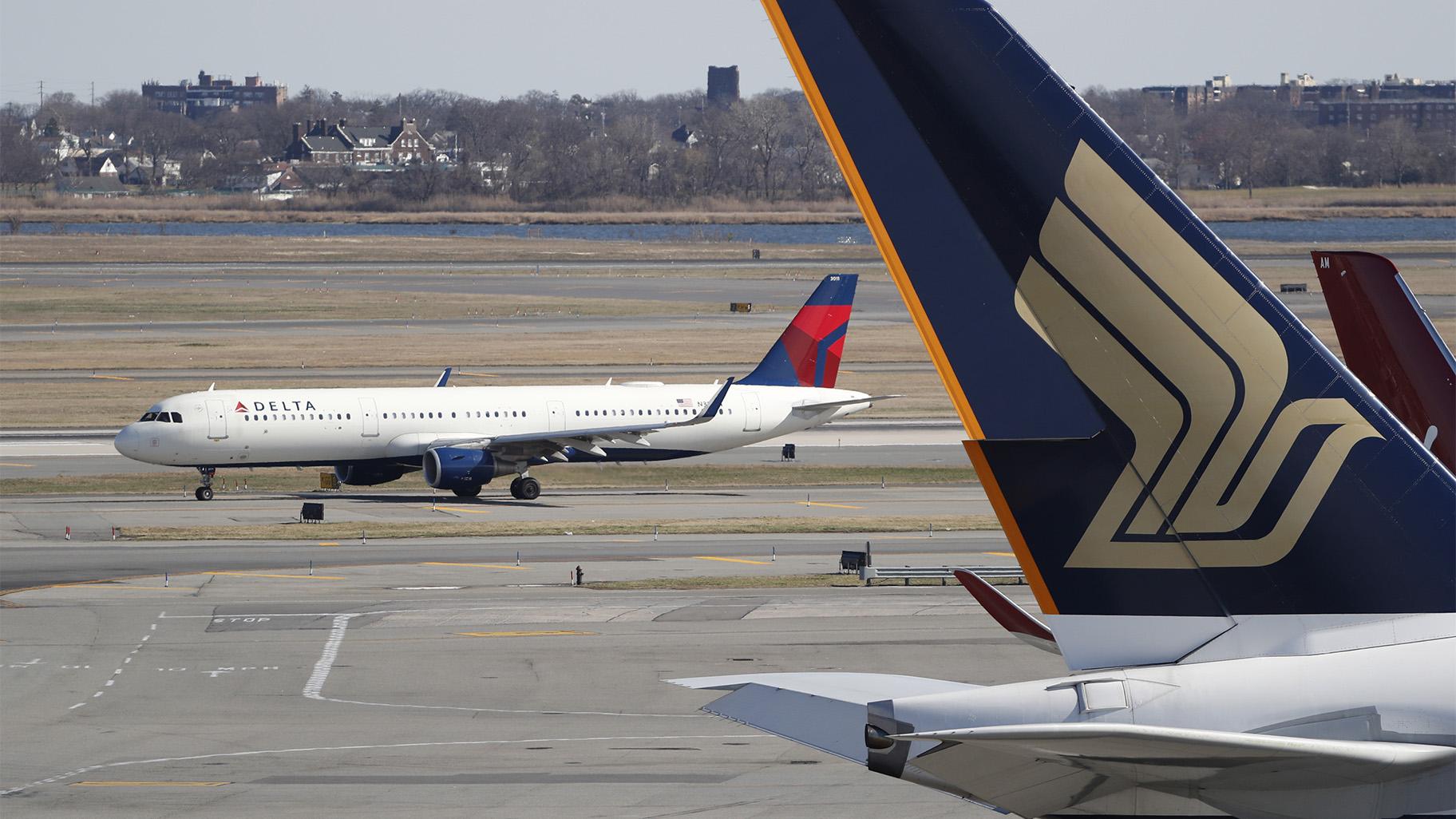 A Delta Air Lines plane taxis down a runway, Saturday, March 14, 2020, at John F. Kennedy International Airport in New York. (AP Photo / Kathy Willens, File)