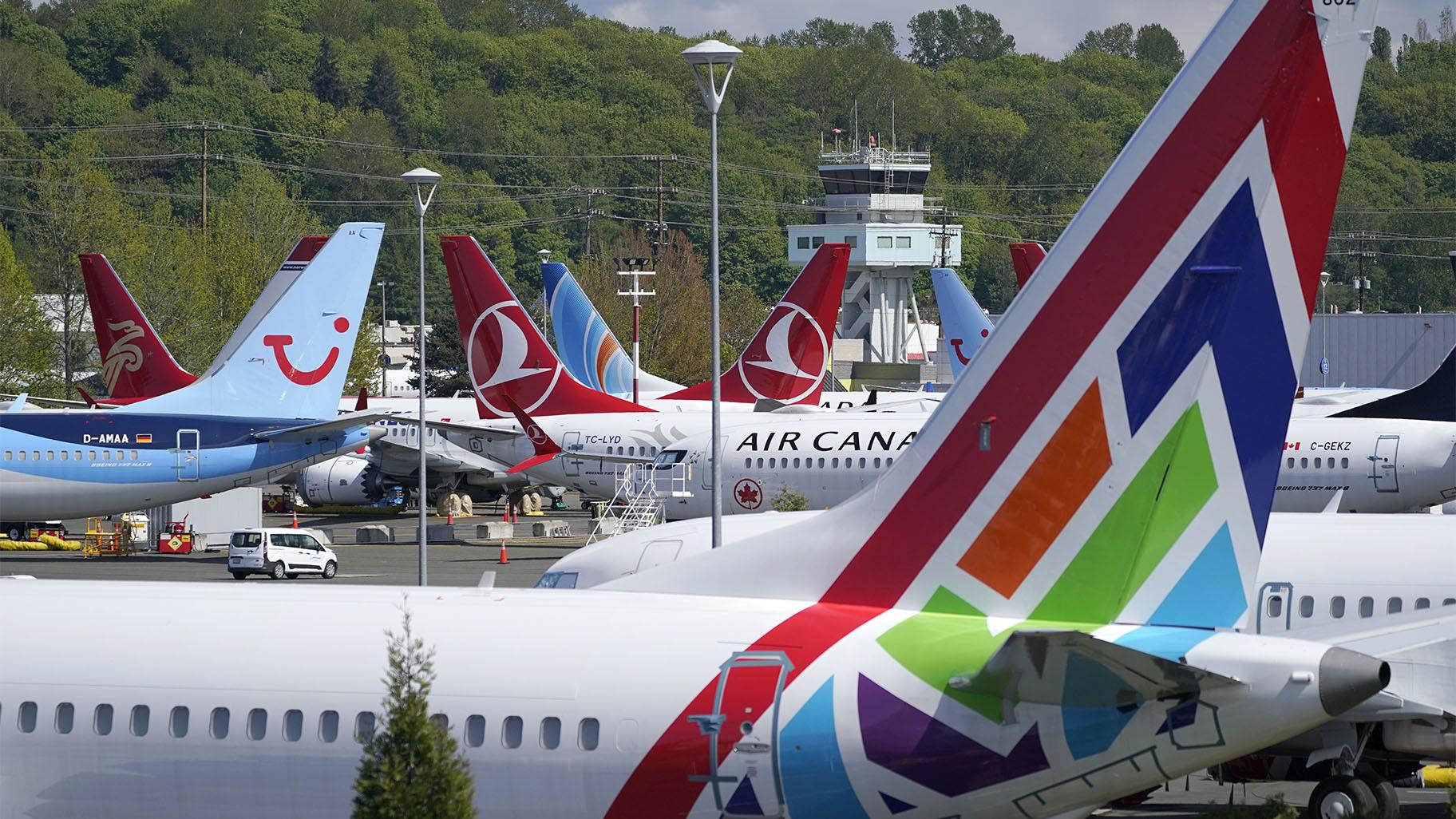Boeing 737 Max airplanes sit parked in a storage lot, Monday, April 26, 2021, near Boeing Field in Seattle. (AP Photo / Ted S. Warren) 