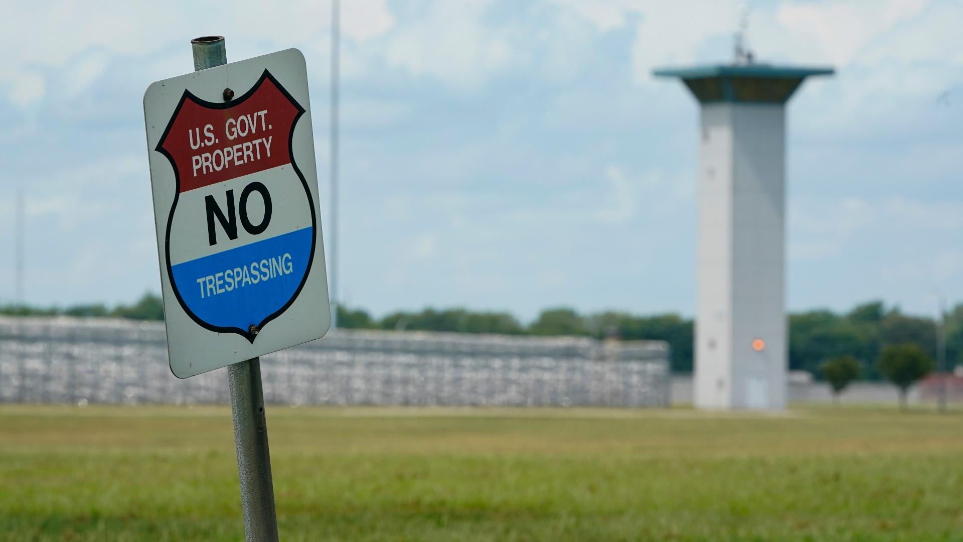 In this Aug. 28, 2020, file photo, a no trespassing sign is displayed outside the federal prison complex in Terre Haute, Ind. (AP Photo / Michael Conroy, File)