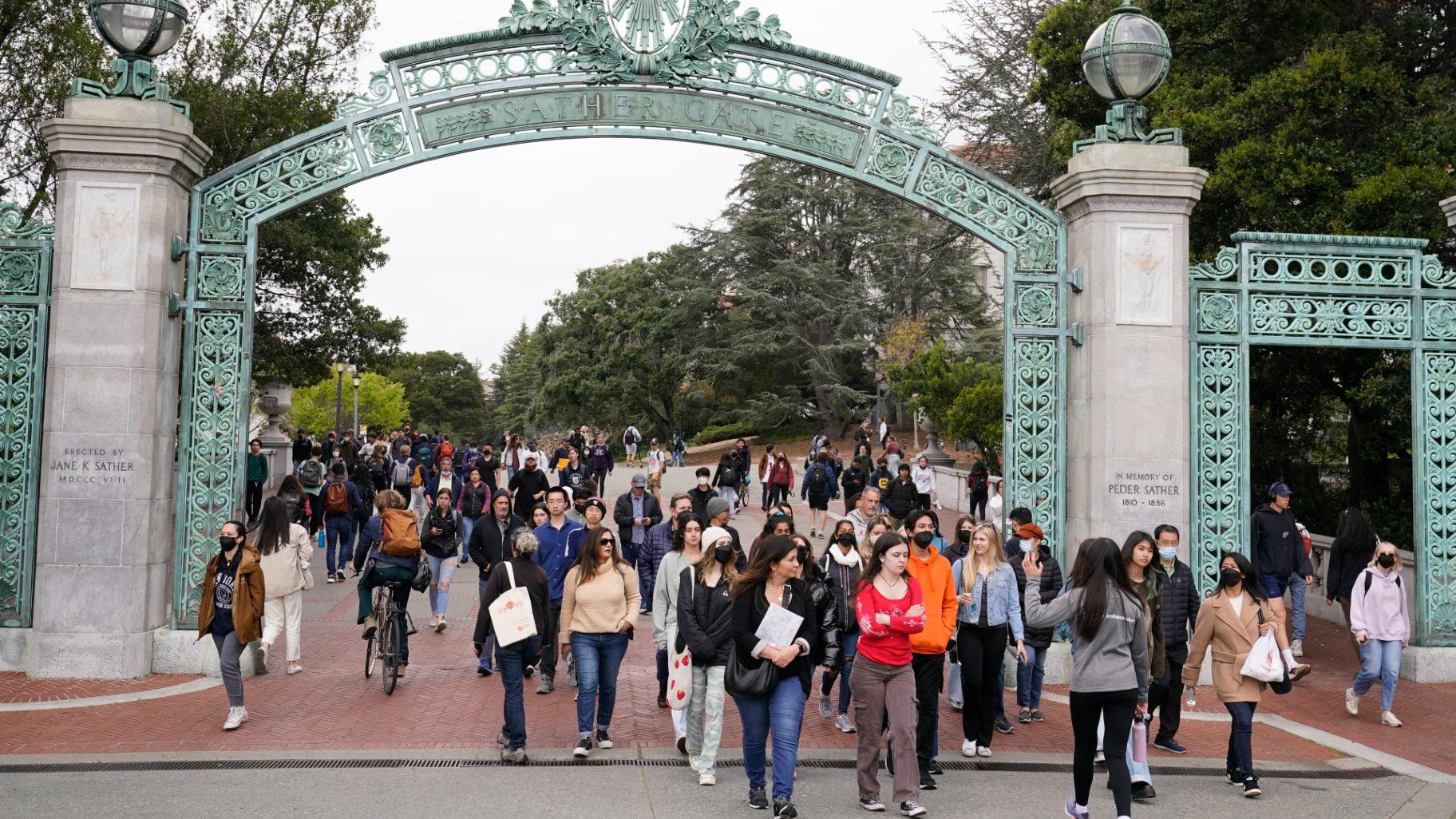 File - Students make their way through the Sather Gate near Sproul Plaza on the University of California, Berkeley, campus March 29, 2022, in Berkeley, Calif. (Eric Risberg / AP Photo, File)