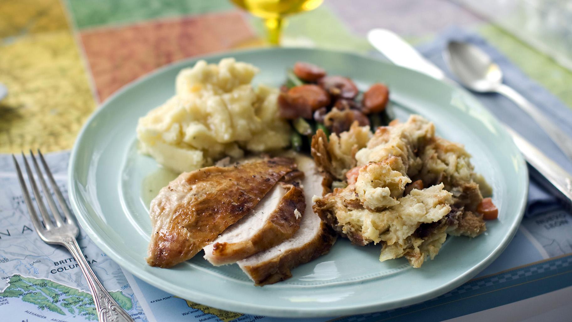 A plate of roasted turkey and gravy, stuffing, mashed potatoes, and glazed carrots appears in Concord, N.H., on Oct. 2, 2012. (AP Photo / Matthew Mead, File)