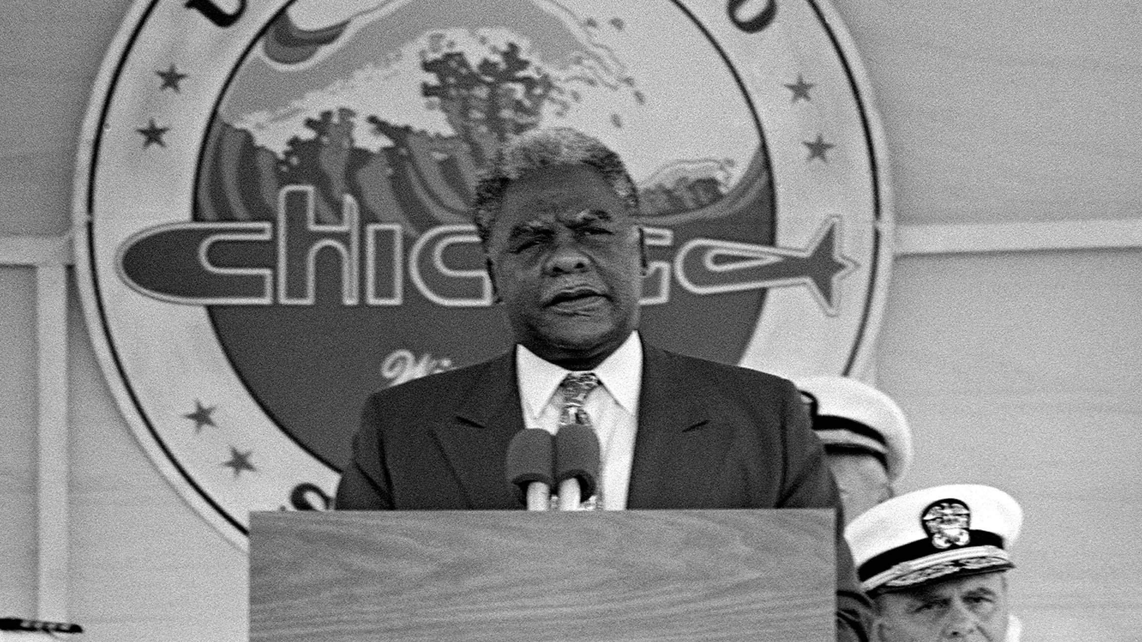 Chicago Mayor Harold Washington speaks during the commissioning of the nuclear-powered attack submarine USS Chicago in September 1986 in Norfolk, Virginia. (The U.S. National Archives)