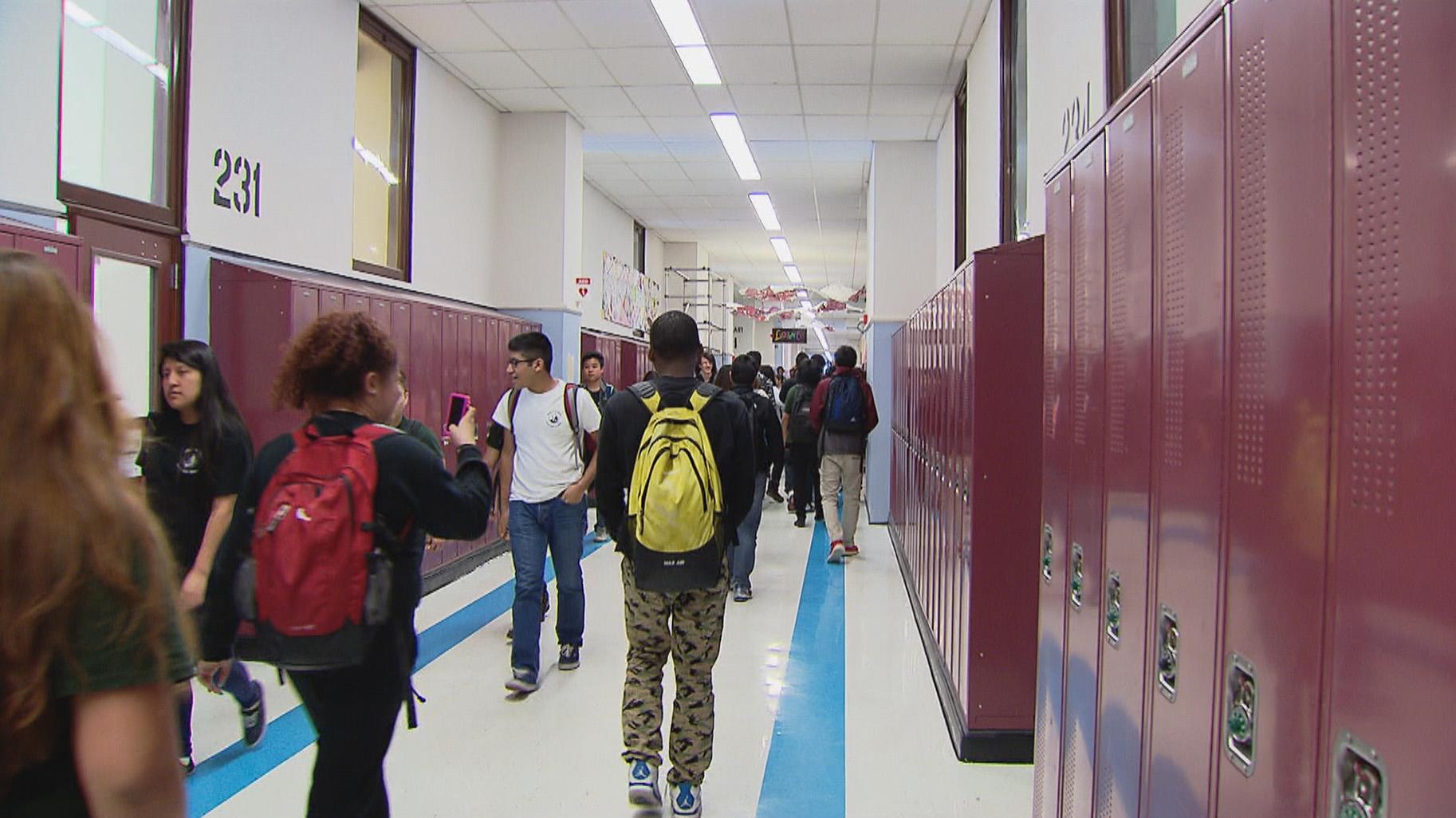 crowded high school hallway with kids